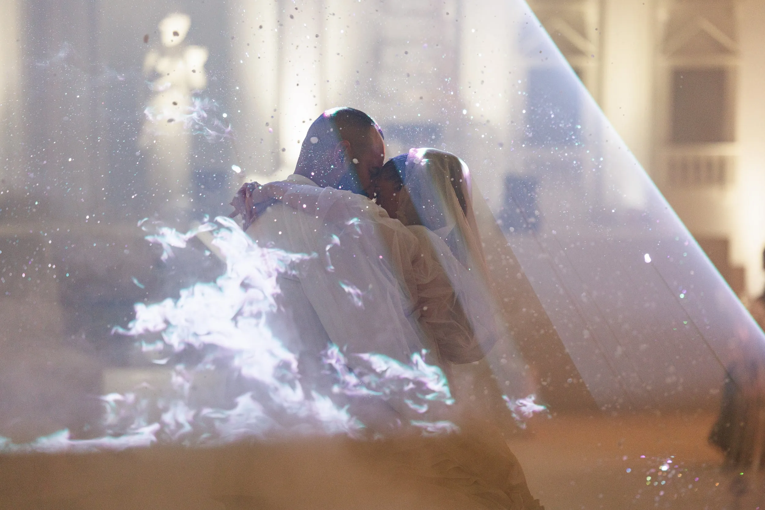 First dance under a laser halo at a wedding